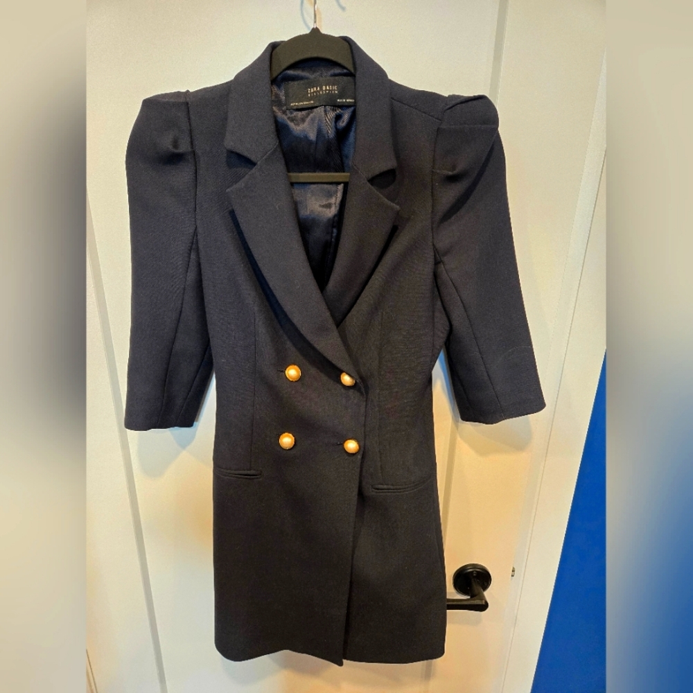 Navy dress coat, fitted with shoulder pads